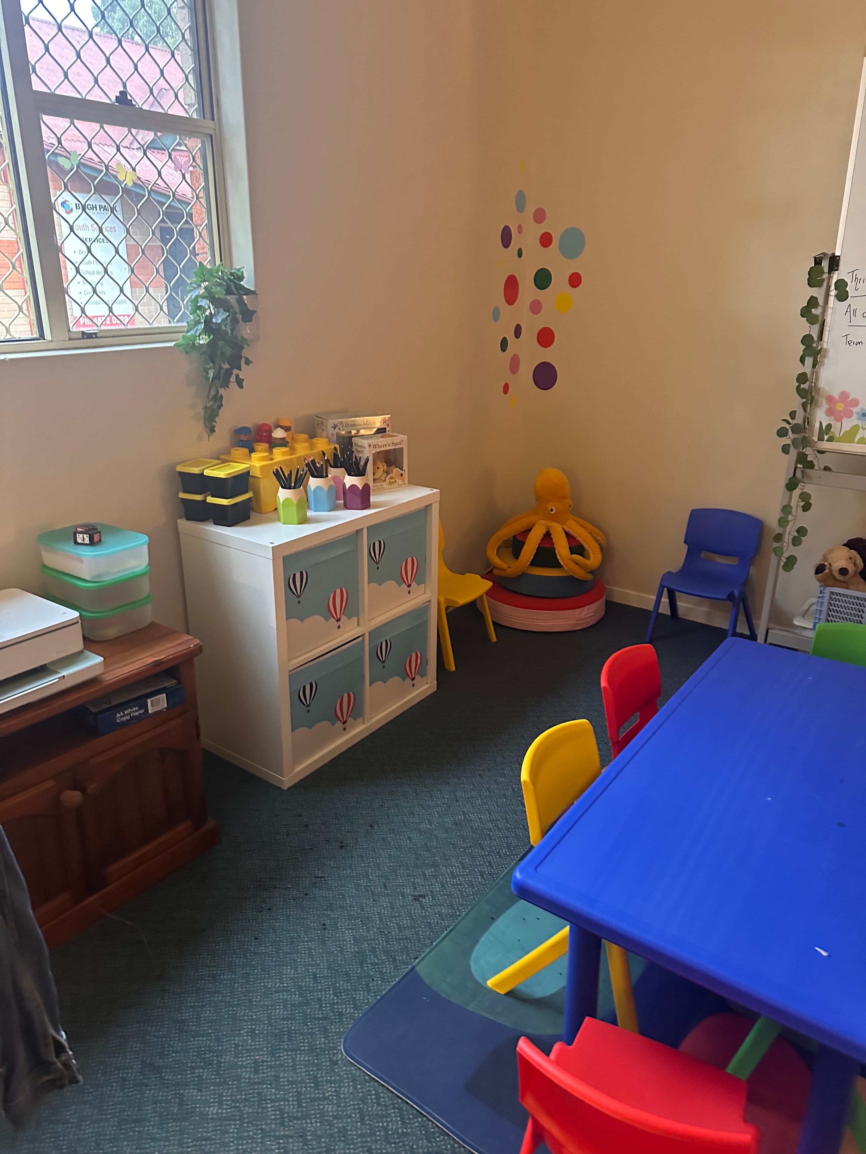 Bright activity corner with toys and learning resources